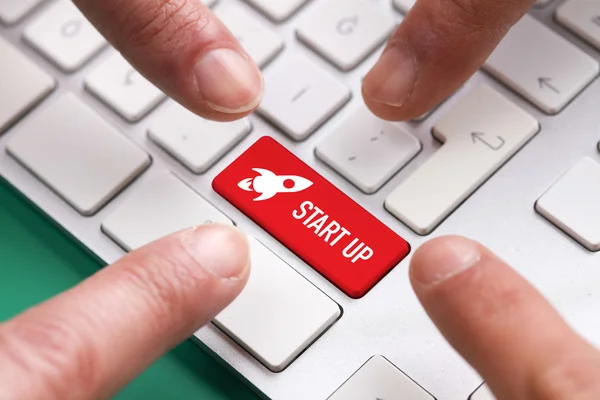 Many fingers pushing red button — Stock Photo, Image