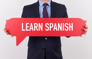 konuşma balonu tutan işadamı