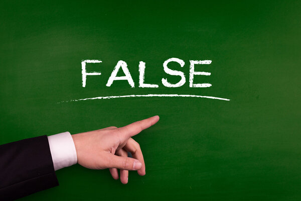 Businessman pointing on blackboard