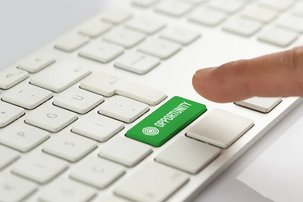 Finger pushing green keyboard button — Stock Photo, Image