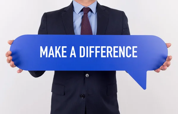 Businessman holding speech bubble — Stock Photo, Image