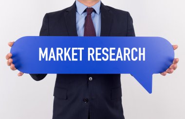 konuşma balonu tutan işadamı