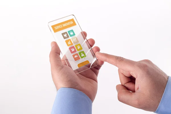 Empresário segurando smartphone transparente — Fotografia de Stock