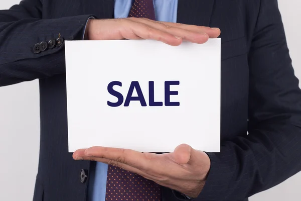 Businessman showing paper — Stock Photo, Image