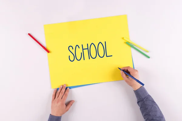 Hand writing on yellow paper — Stock Photo, Image