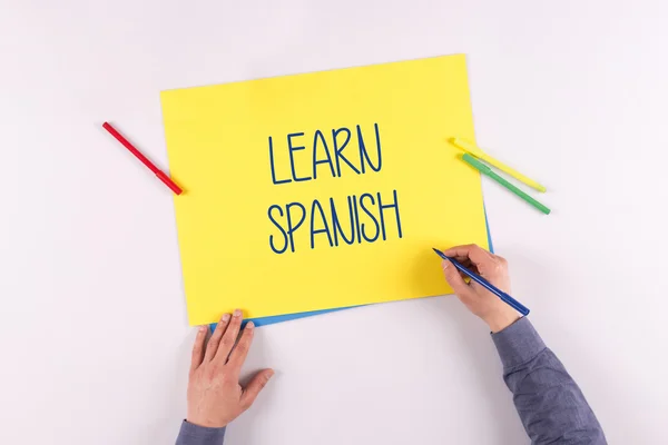 Hand writing on yellow paper — Stock Photo, Image