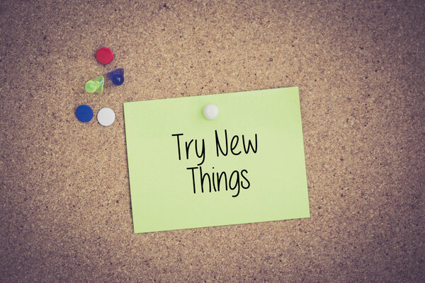 sticky note pinned on pinboard