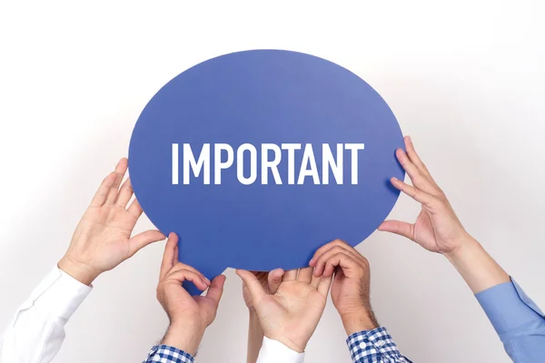 Group of people holding speech bubble — Stock Photo, Image