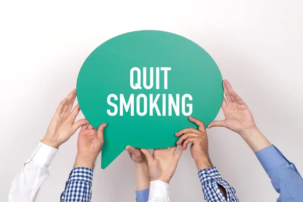 Group of people holding speech bubble — Stock Photo, Image