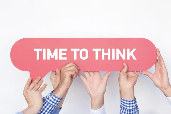 Group of people holding speech bubble — Stock Photo, Image