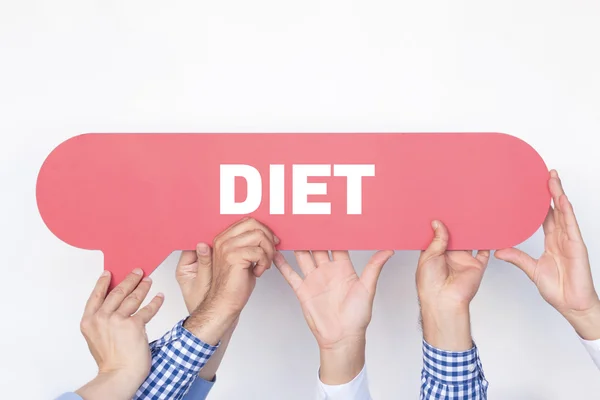 Group of people holding speech bubble — Stock Photo, Image