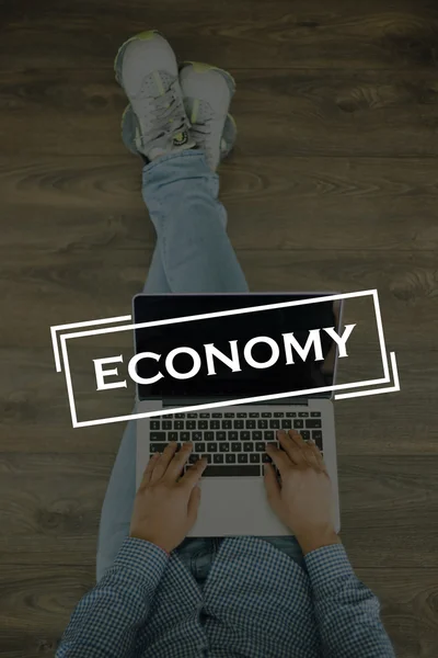 Young man sitting on floor with laptop — Stock Photo, Image