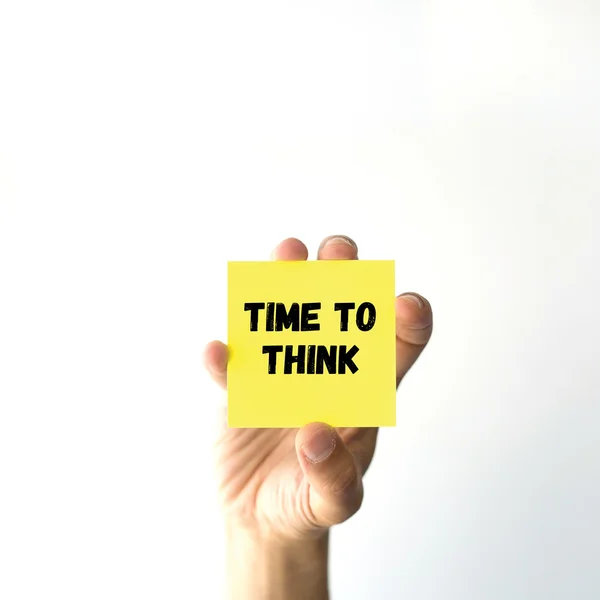 Hand holding yellow sticky note — Stock Photo, Image