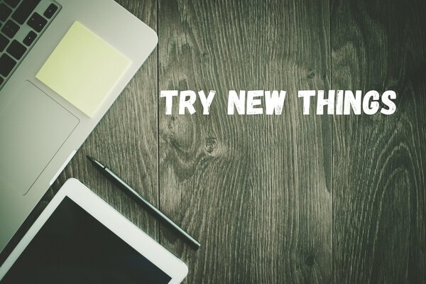 TRY NEW THINGS  text on desk 