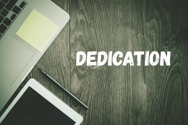 DEDICATION text on desk — Stock Photo, Image