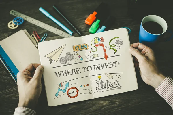 WHERE TO INVEST? sketch on notebook — Stock Photo, Image