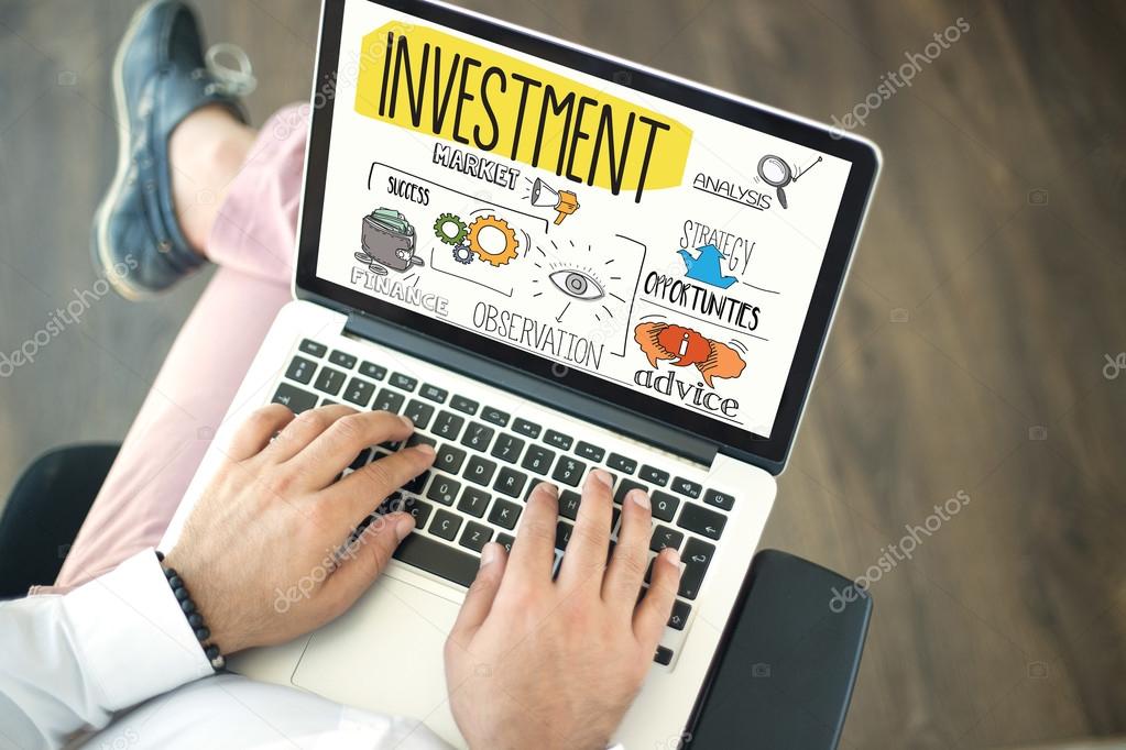 INVESTMENT text on screen. Stock Photo by ©garagestock 125298708