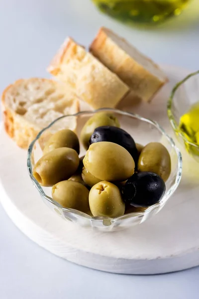 Bowls Green Black Olive Olive Oil White Tray Artisan Bread — Stock Photo, Image