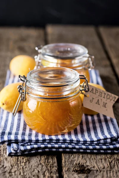 Glass Jars Homemade Apricot Jam Linen Napkin Wooden Background Vertical — Zdjęcie stockowe