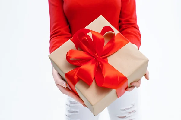 Joyful woman holding a box with gift — Stock Photo, Image