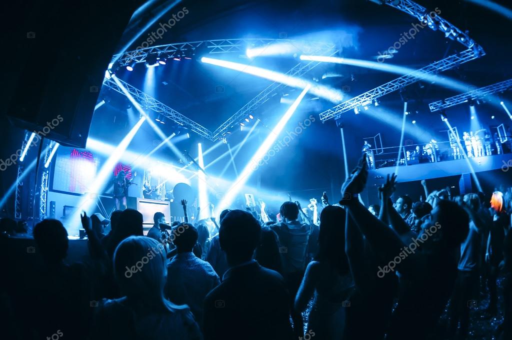 Night club party event concert with rave crowd of people at the stage Stock  Photo by ©glazok90 106182394