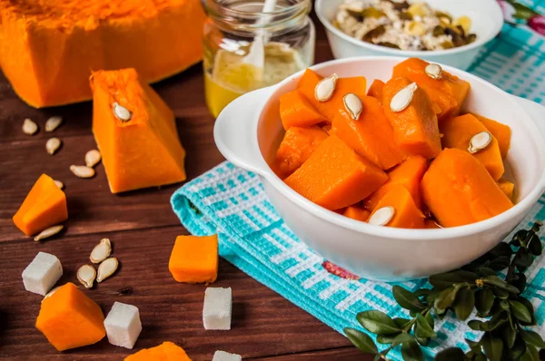 Pumpkin puree with fruits on a black wooden background. Top view — Stock Photo, Image