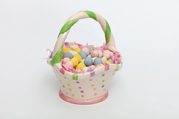 Easter eggs in a ceramic basket — Stock Photo, Image