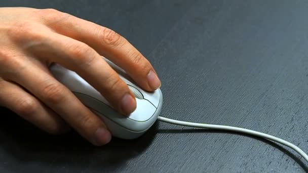 Mouse 4. Soft focus to hand of the man clicking middle mouse button. Right hand from right top view. — Stock Video