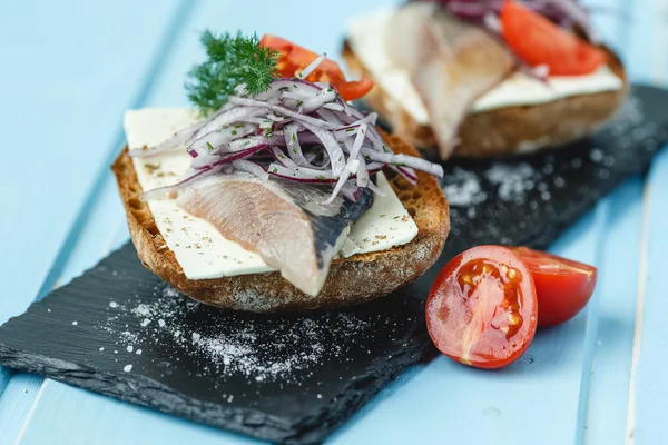 Herring sandwich with vegetable — Stock Photo, Image