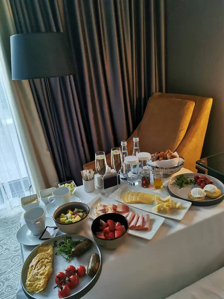 Luxurious breakfast for the newlyweds at the hotel. Breakfast in the room