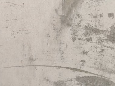 Eski beton duvarın dokusu. Açık gri çimento desenli beton duvar. Gri pastel, çatlak, çimento, taş, kaya, sıva, düz arka plan. Eski beton duvar dokusu.