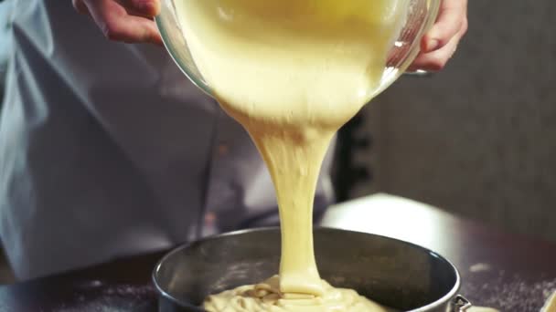 Cake batter pouring into baking dish. Home baking. Baking cake — Stock Video