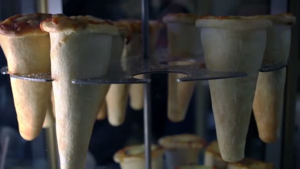 Cone pizza on revolving stand. Street fast food. Delicious cone pizza — Stock Video