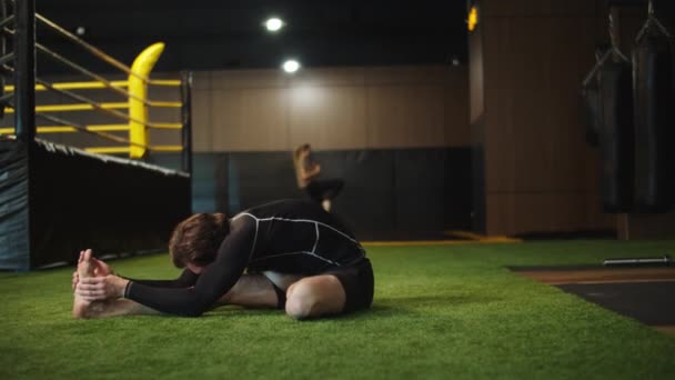 Strict sport man warming up in fitness center. Male boxer exercising at gym — Stock Video