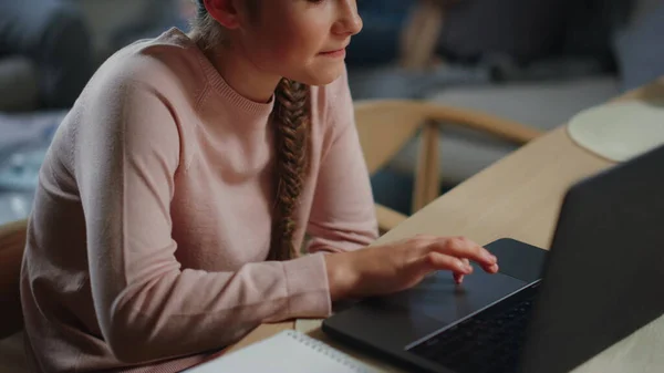 Smart girl learning online home. Cute schoolgirl looking computer screen indoors