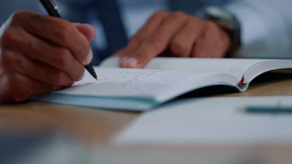 Businessman hands making notes in notebook. Man arms crossing text in notebook — Stock Photo, Image