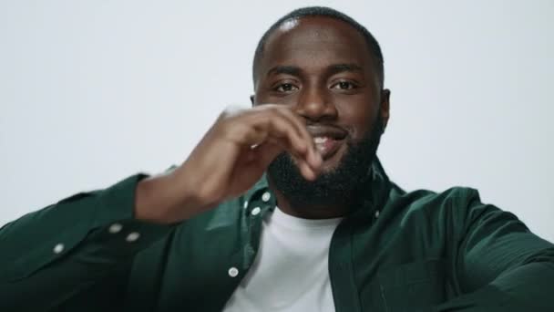 Portrait of bearded african american man dancing on light background. — Stok Video