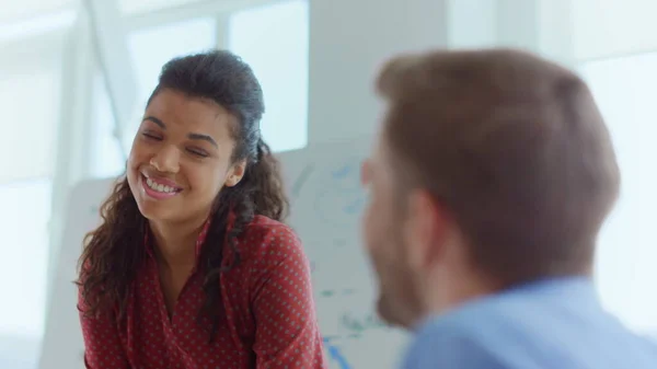 Afro woman tapping man shoulder office. Businesswoman congratulating manager.