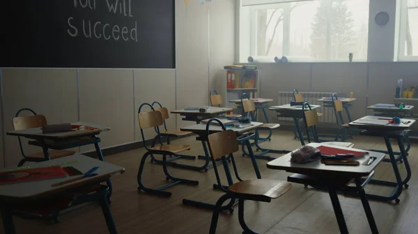 Classroom with desks and chairs in school. Interior of elementary school class — Stock Photo, Image