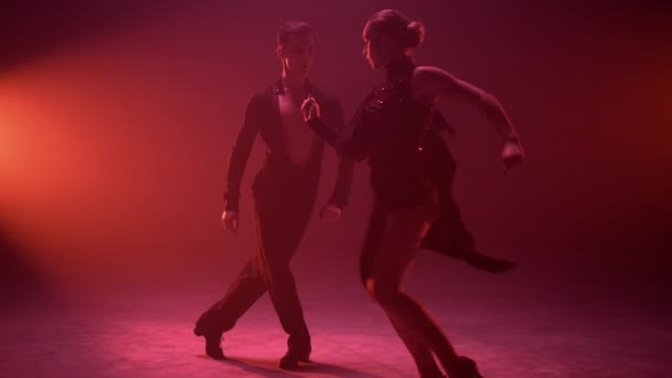 Sexy dancers enjoying performance on stage. Sensual couple dancing samba indoors — Stock Video