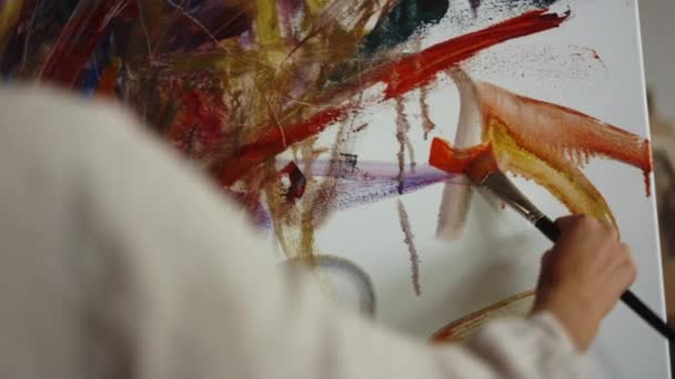 Unknown painter making brush stroke indoors. Female artist working in studio. — Stock Video