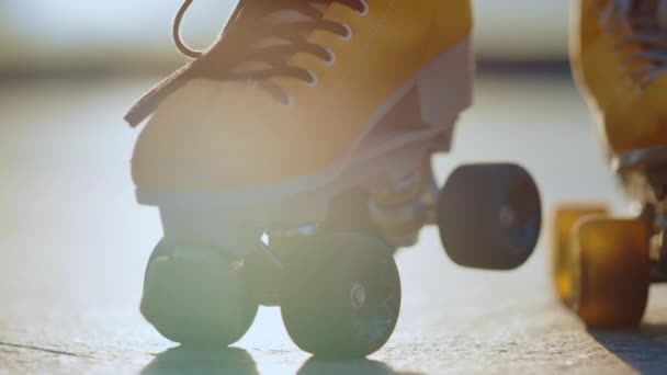 Yellow rollerblades for unknown female skater staying outdoors. Sports concept. — Stock Video