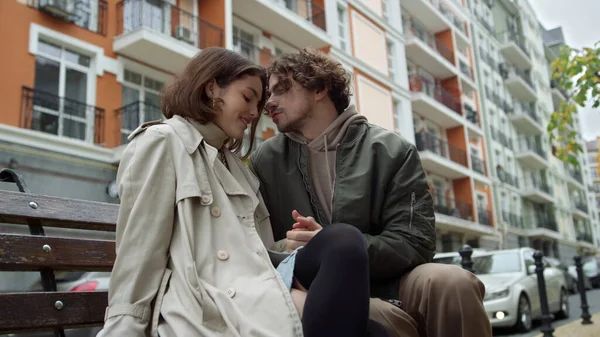 Lovely couple having date outdoor. Man caressing woman hand on city street. — Stock Photo, Image