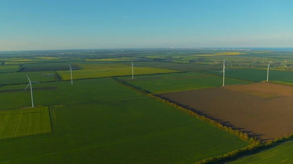 Aerial view wind turbines producing alternative energy for sustainable industry.