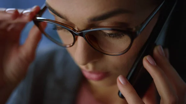 Business woman face closeup. Disappointed businesswoman calling mobile phone