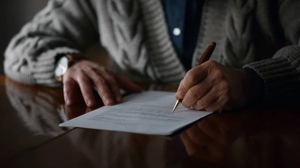Elderly man hands working document at home. Old male arms making marks contract — Stock Photo, Image