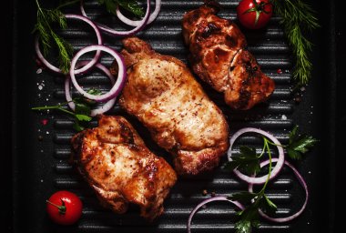 Roasted beef steak with vegetables on the grill pan