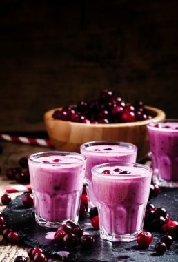 Pink smoothies with milk, black currants and cranberries