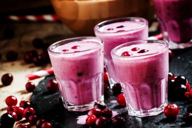 Pink smoothies with milk, black currants and cranberries