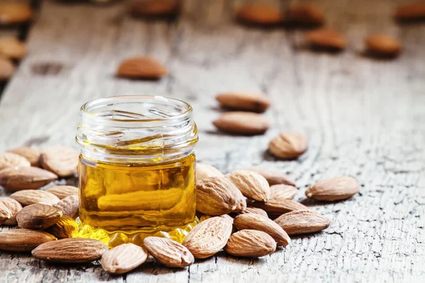 Sweet Almond Oil, first extraction, in a small glass jar — Stock Photo, Image